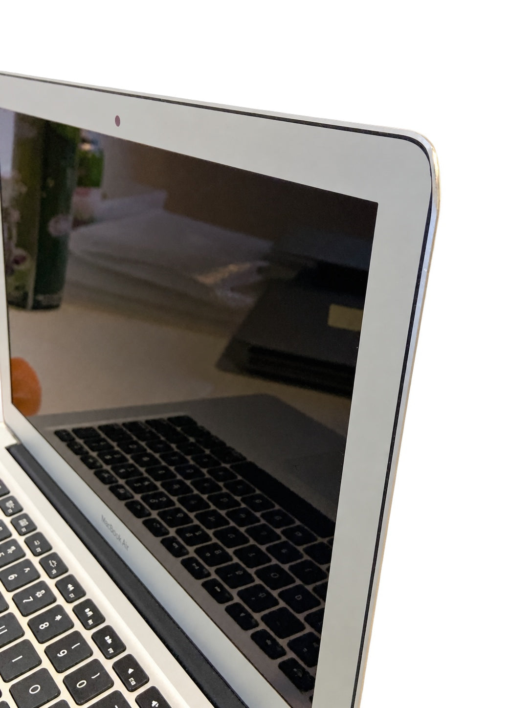 Actual Apple MacBook Air 13.3-inch 2015 screen and edge condition on white background