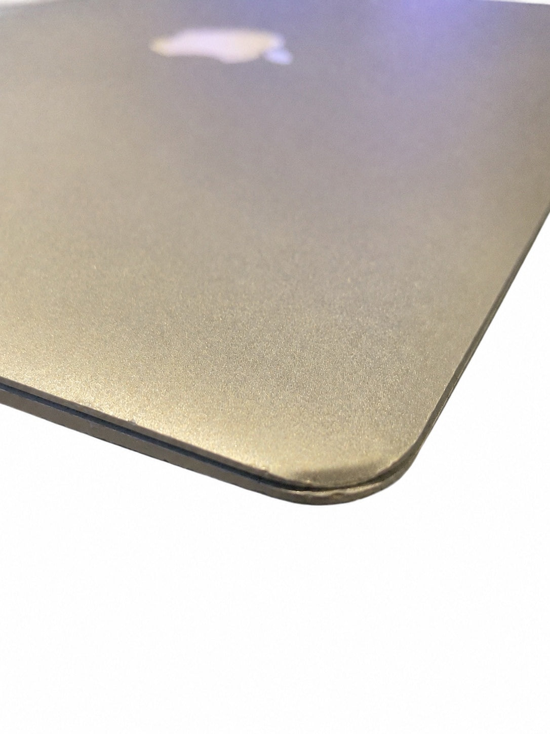 Actual Apple MacBook Air 13.3-inch 2015 right corner dent on white background