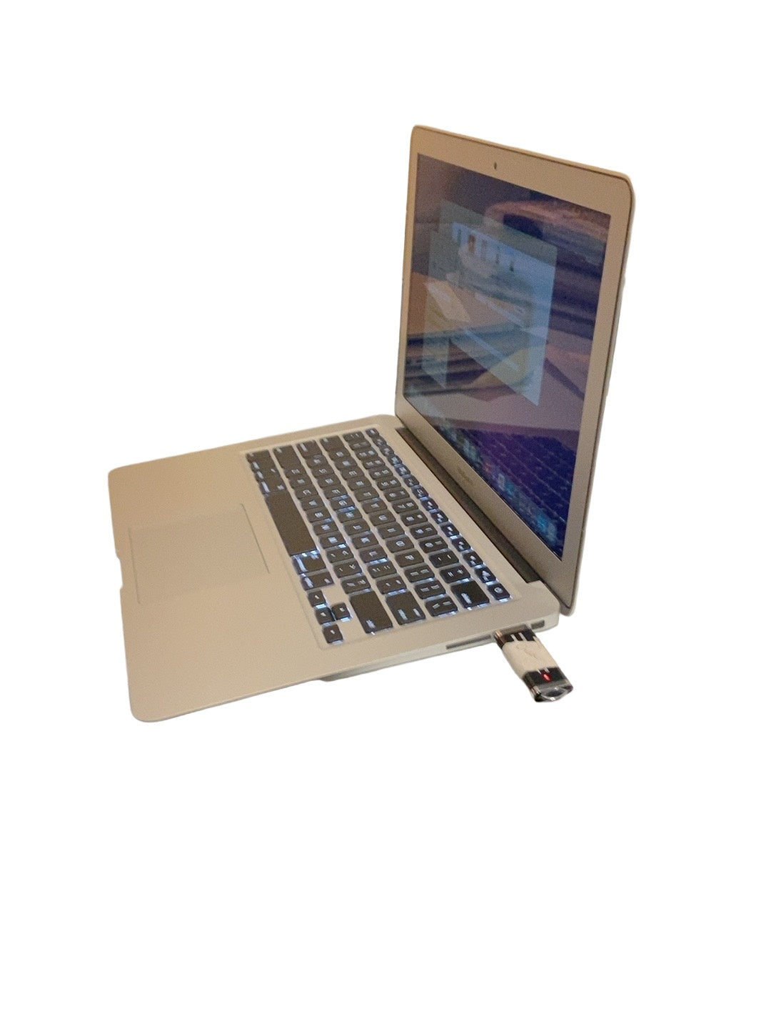 Actual Apple MacBook Air 13.3-inch 2017 angled view on white background