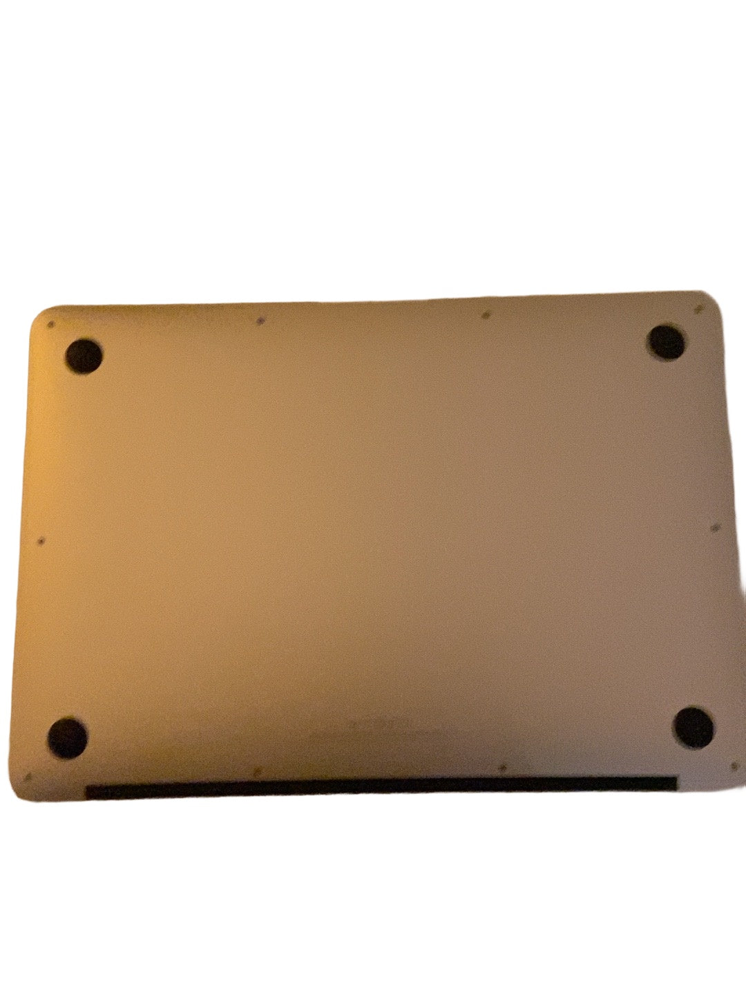 Actual Apple MacBook Air 13.3-inch 2017 underside condition on white background