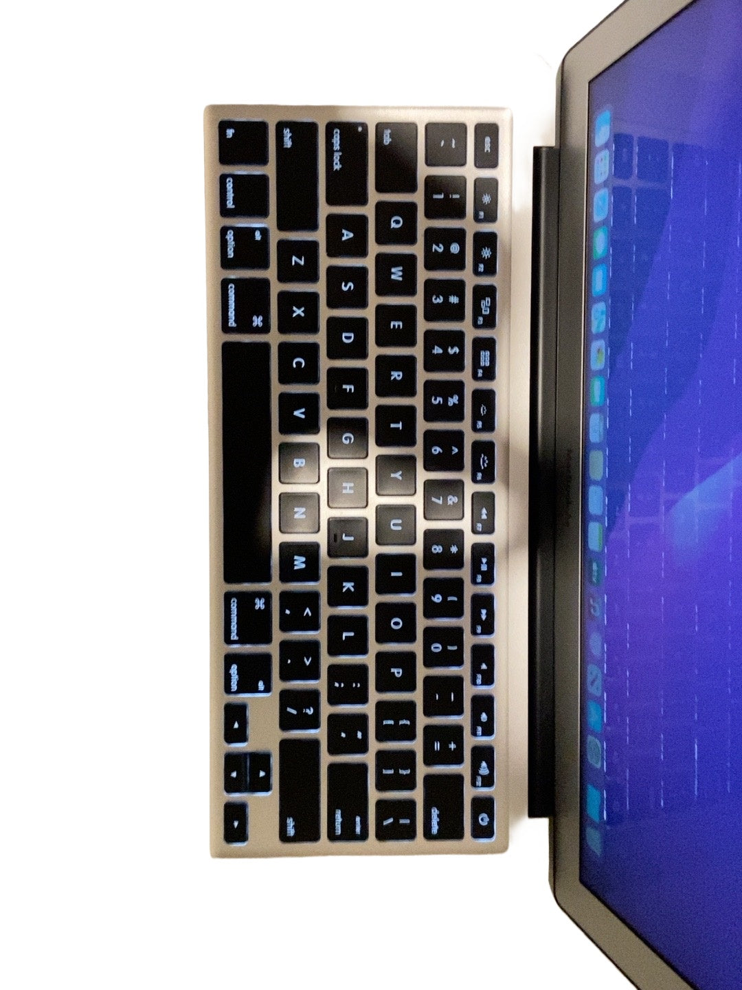 Actual Apple MacBook Air 13.3-inch 2017 keyboard and palm rest on white background